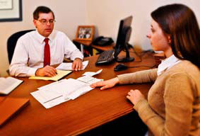 Attorney and client going over documents 